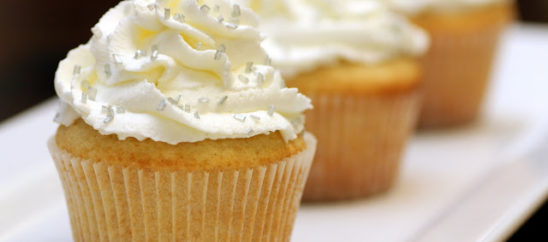 Vanilla Cupcakes with Sweetened Whipped Cream Frosting