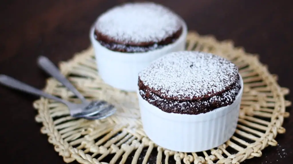 Chocolate soufflé with cream and cocoa-powder